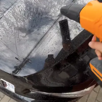 The SuperLeafBlower drying water off a car