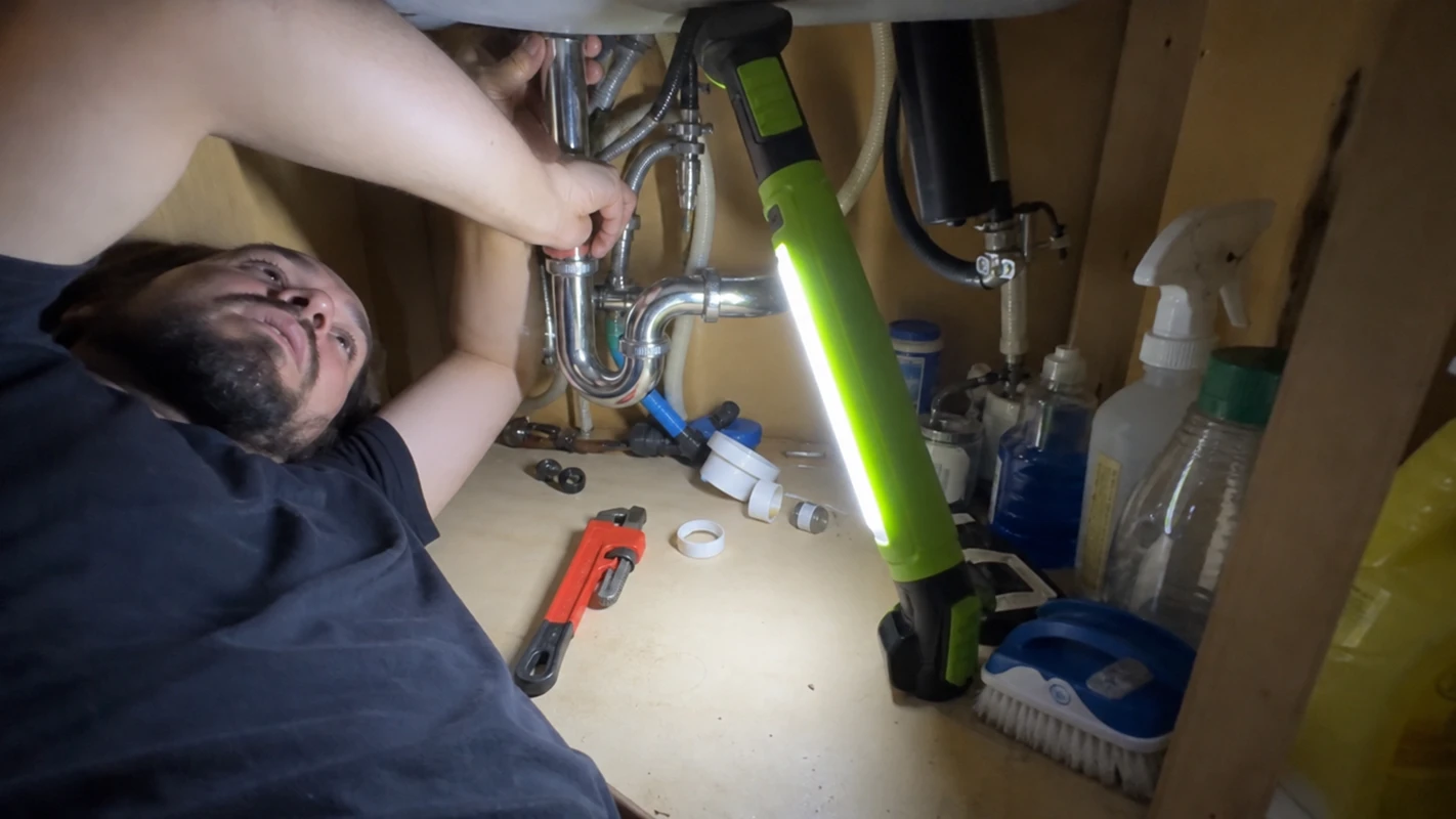 SuperTorch customer photo, mechanic using the light deep in a car engine